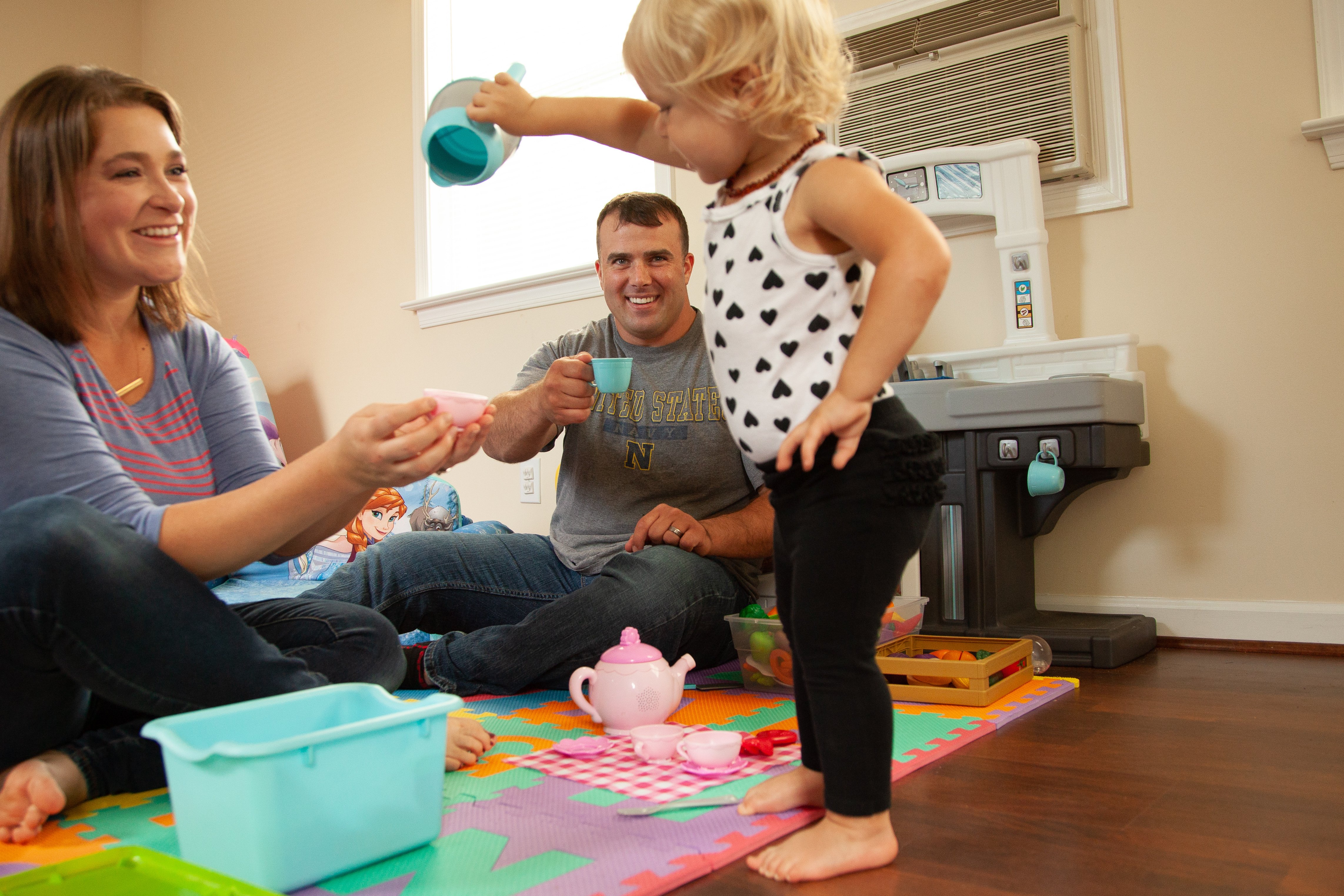 Military family playing with daughter